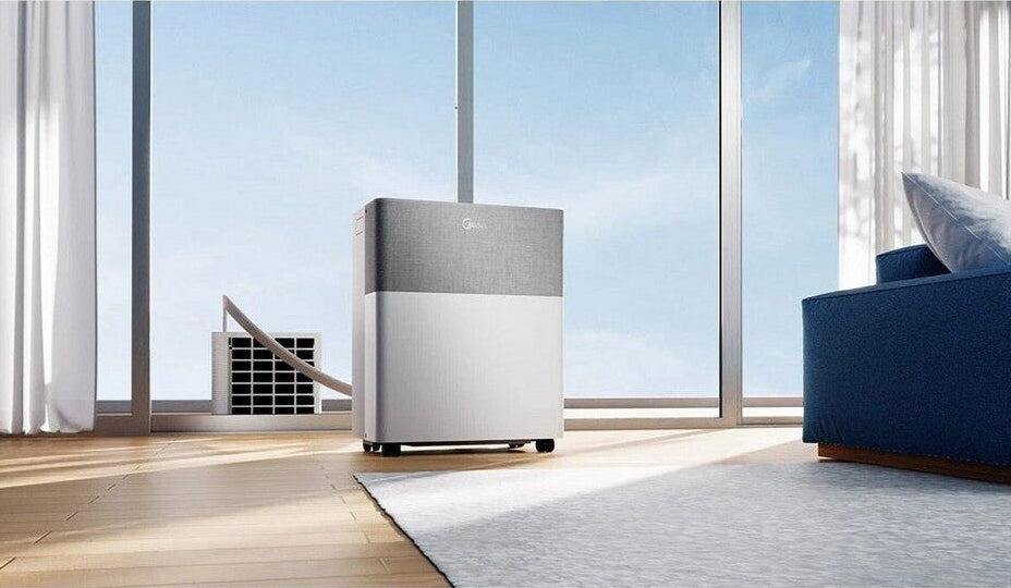 Air purifier in a modern living room with large windows